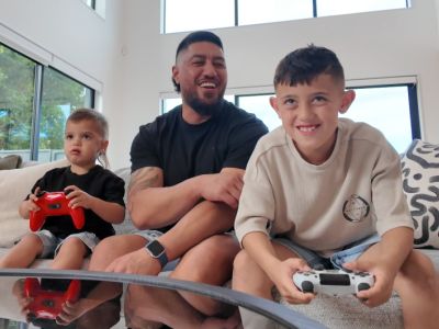 A family games together at home; a positive parenting strategy to help avoid gaming addiction in children.