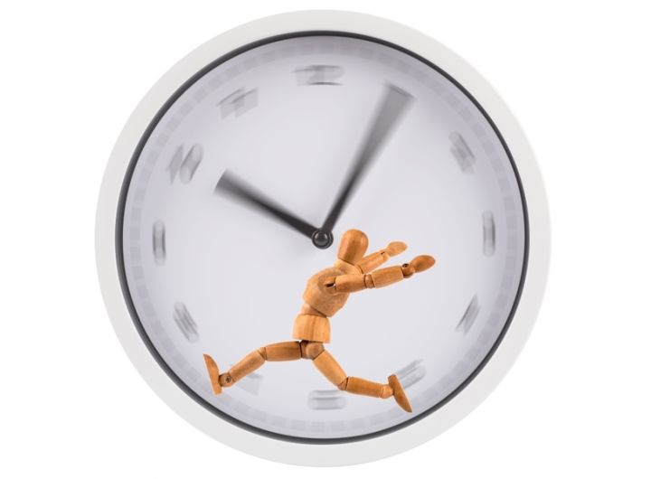 figure running on a hamster-wheel type blurry clockface