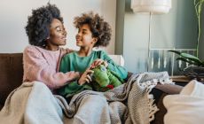mother and daughter share happy moment in lounge room